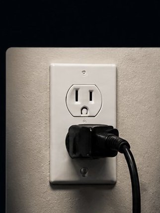 Outlet repair electrician installing GFCI outlet in Denver Colorado home